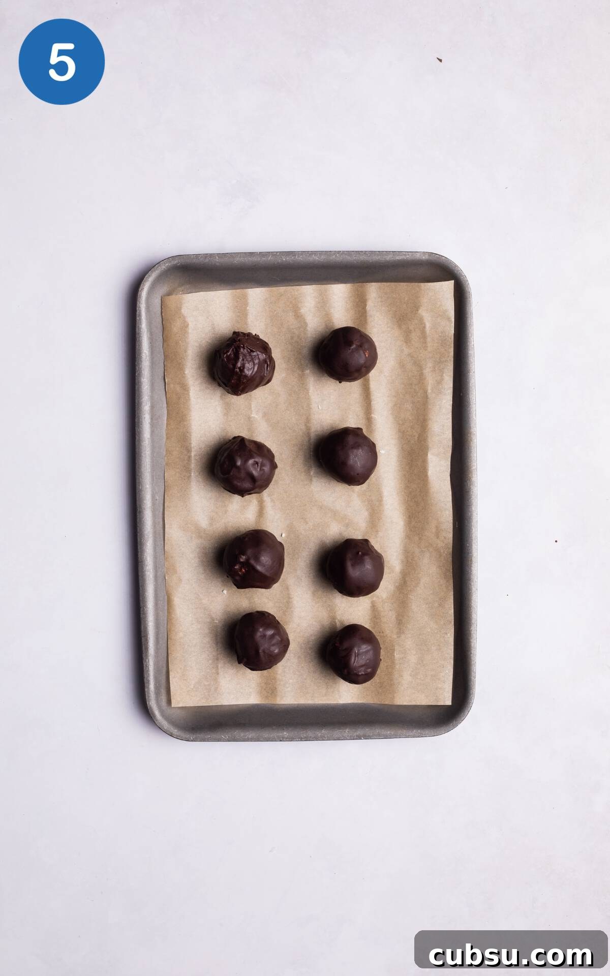 No-Bake Chocolate Coconut Energy Bites 8 Coconut balls coated with chocolate.
