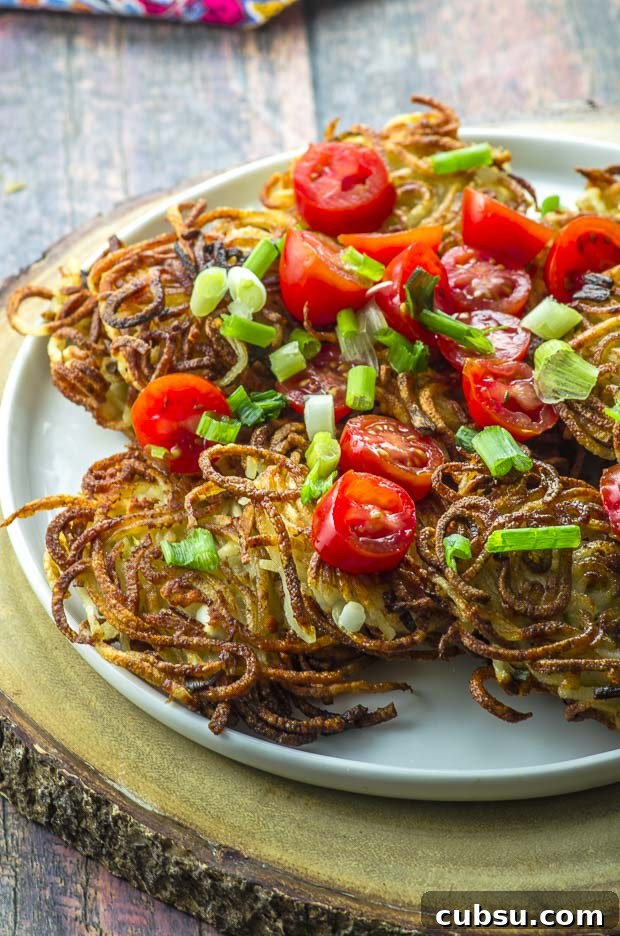 A white plate filled with the crispiest potato latkes for hannukah