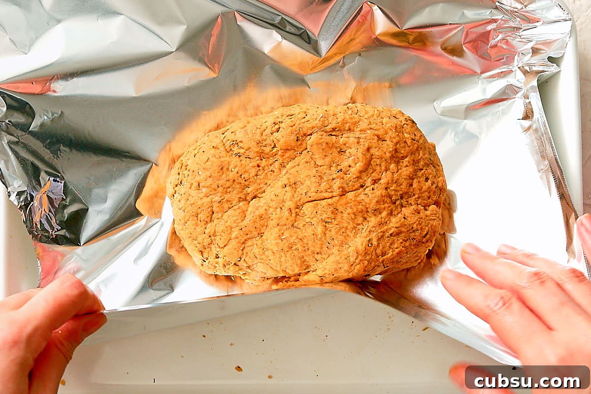 Seitan Vegan Gyros: Flavorful Plant-Based Greek Wrap Recipe 8 Shaping seitan into a block and wrapping in tinfoil before baking.