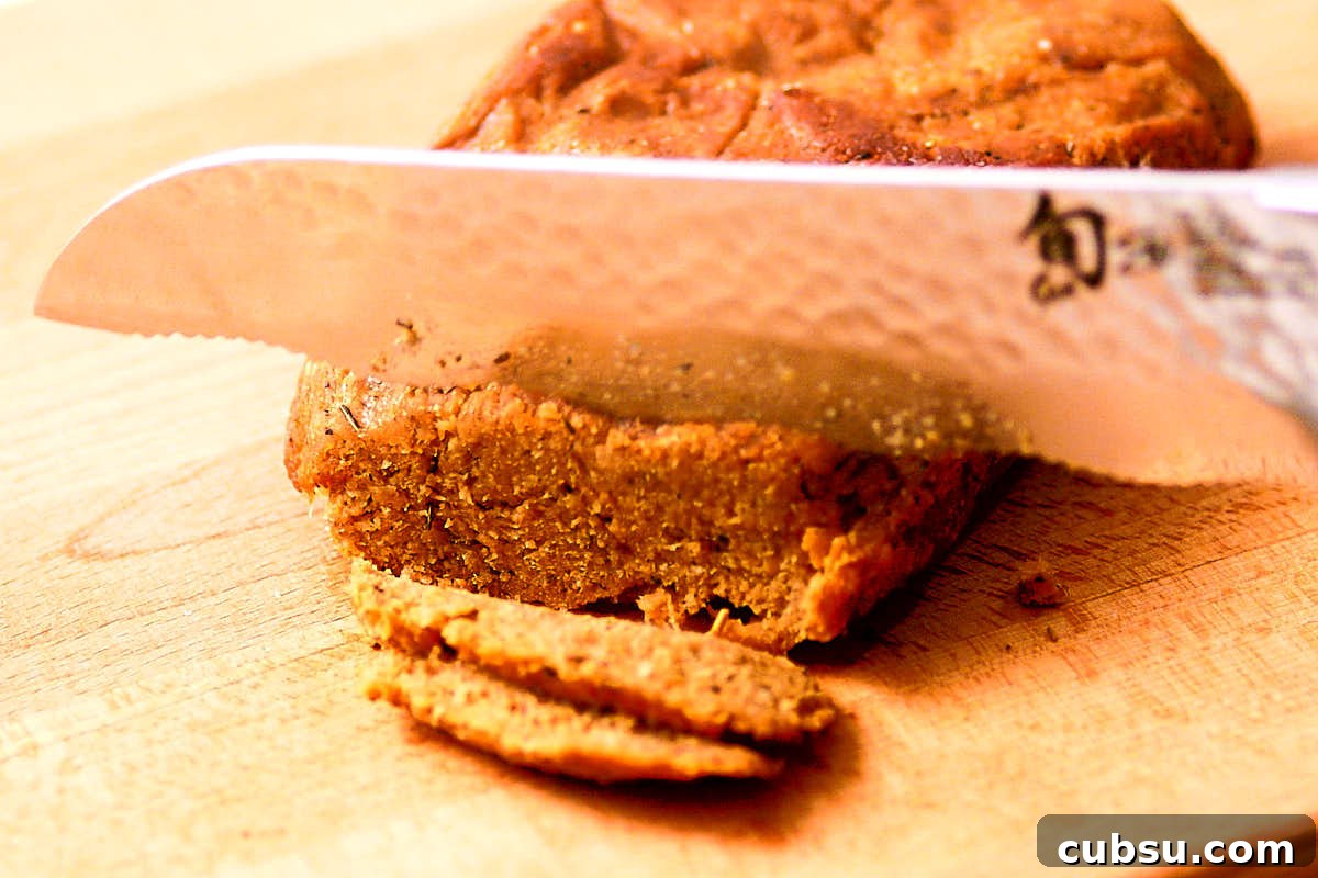 Seitan Vegan Gyros: Flavorful Plant-Based Greek Wrap Recipe 9 Slicing seitan into strips for vegan gyros.