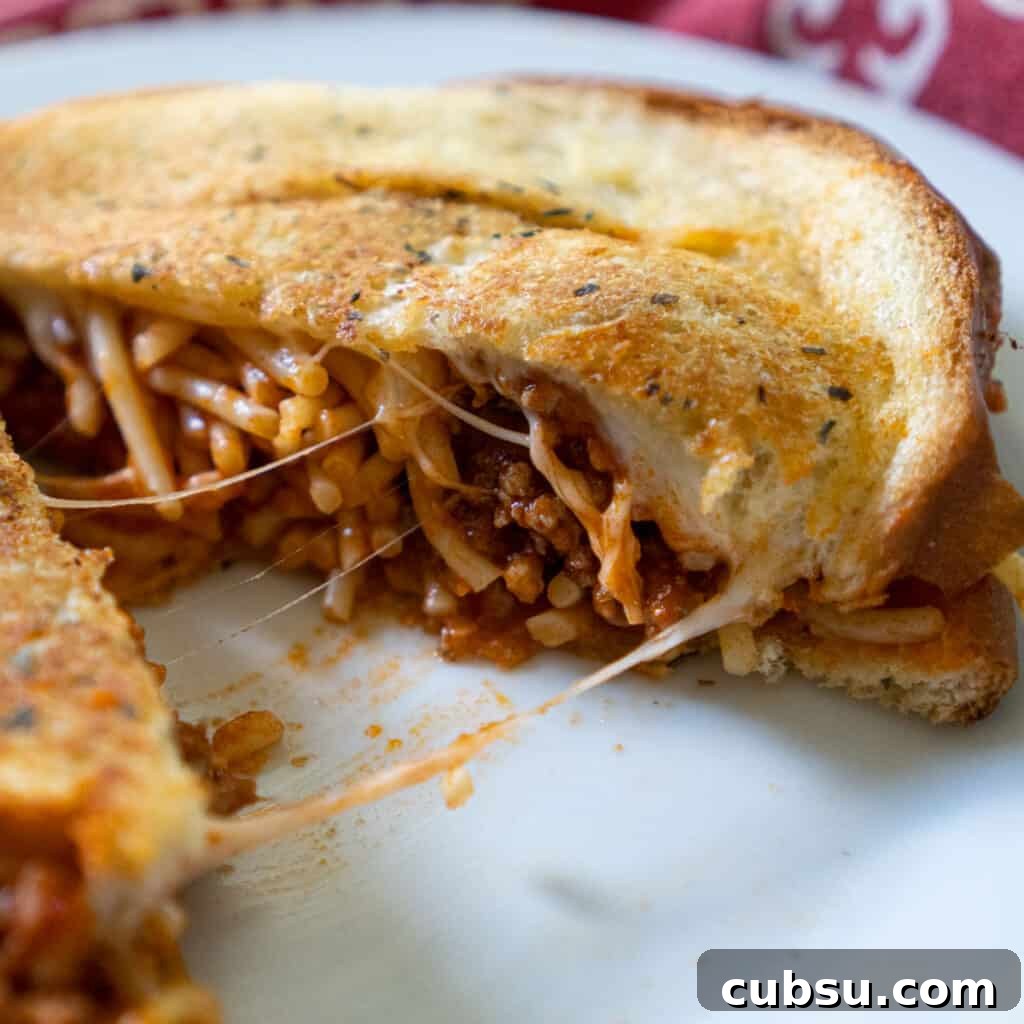 spaghetti sandwich grilled cheese on white plate with red napkin