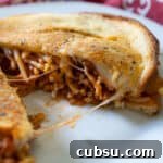 spaghetti sandwich grilled cheese on white plate with red napkin