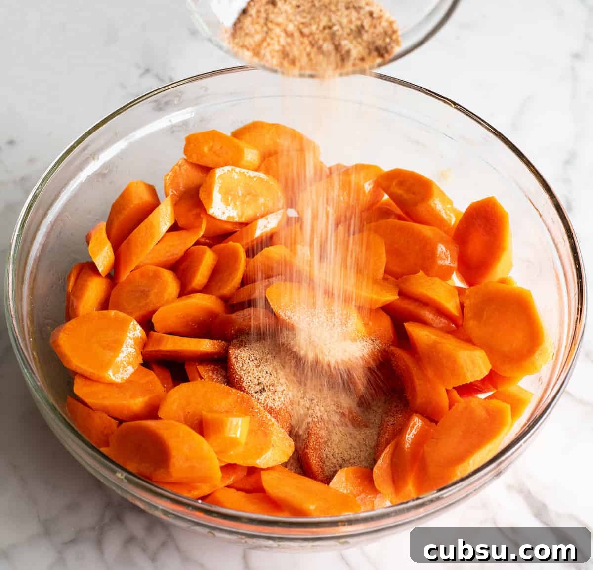 photo showing how to roast carrots - adding spice mixture
