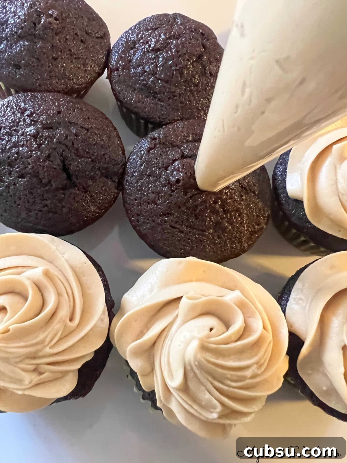 Decadent Mocha Cupcakes: Rich Coffee Chocolate Recipe 4 Filling the mocha cupcakes with frosting.