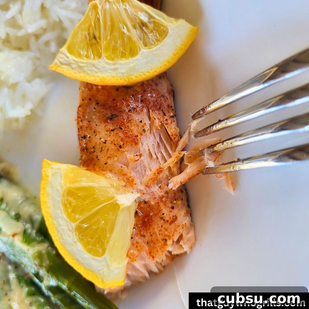 Grilled salmon served with cheesy asparagus and white rice