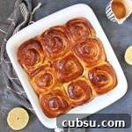 Lemon Glazed Sweet Rolls Recipe – Soft, Zesty Breakfast Buns 7 9 Rolls in a white baking dish from above