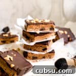 Stack of Homemade Dessert Bars with Peanut Butter and Melted Dark Chocolate