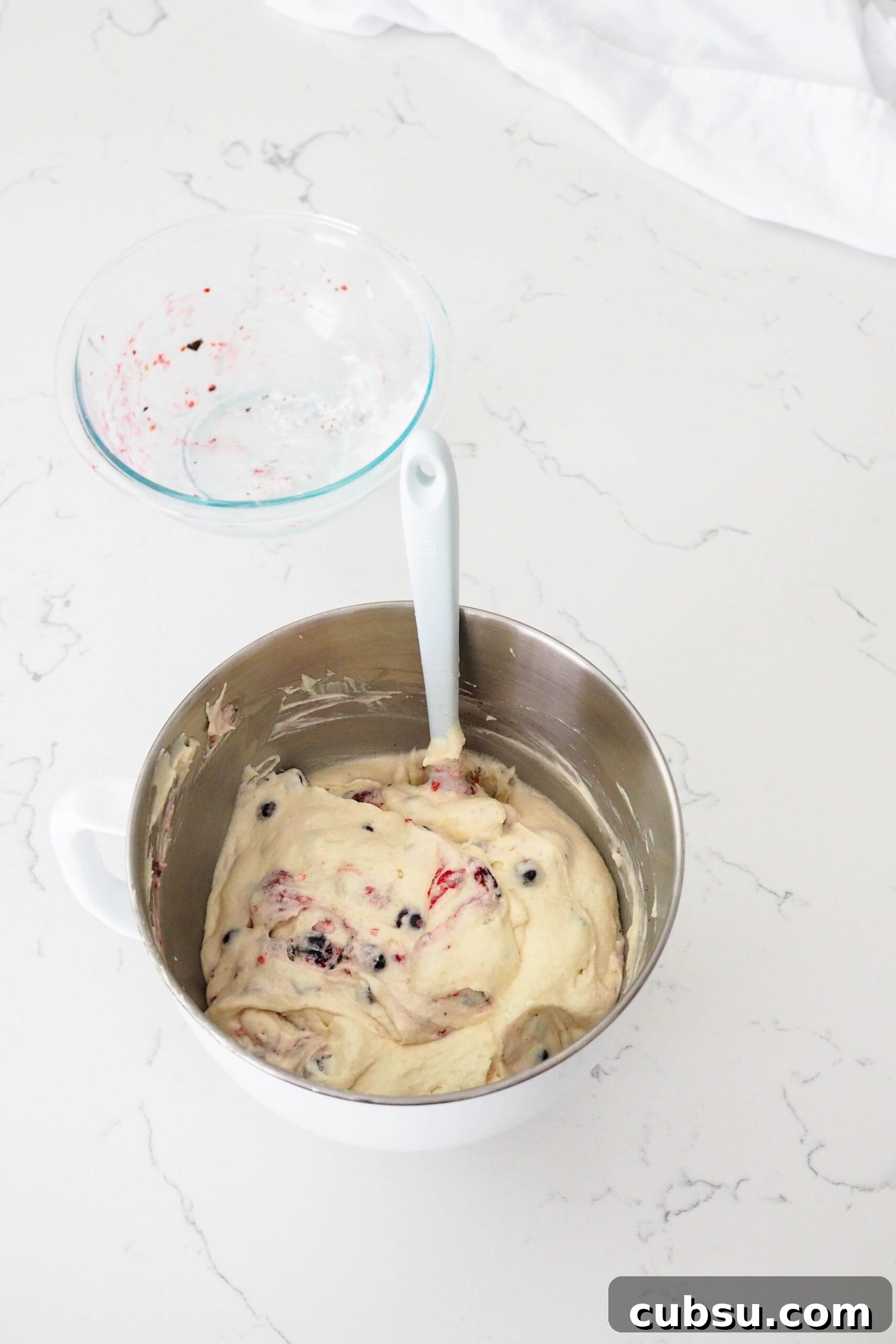Berries are folded into a fluffy Bundt cake batter.