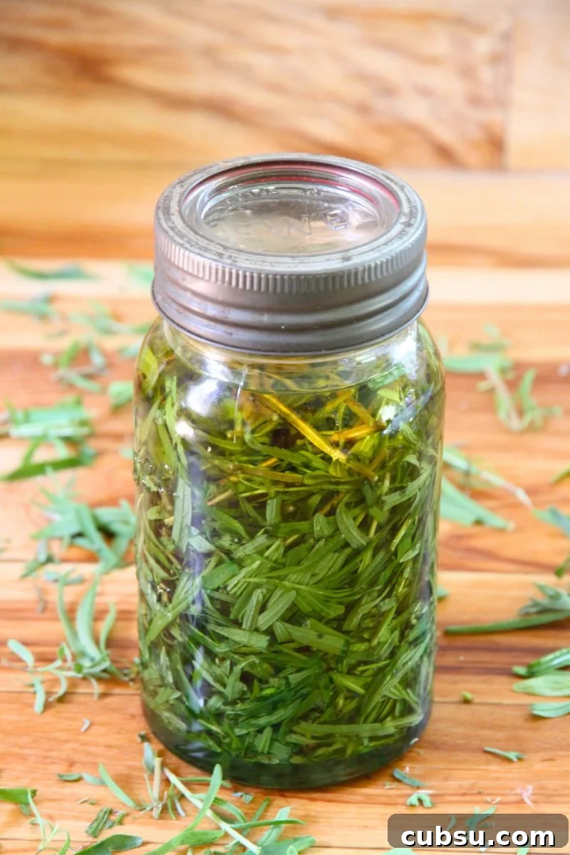 A jar of fresh lavender with oil, ready to sit and infuse.