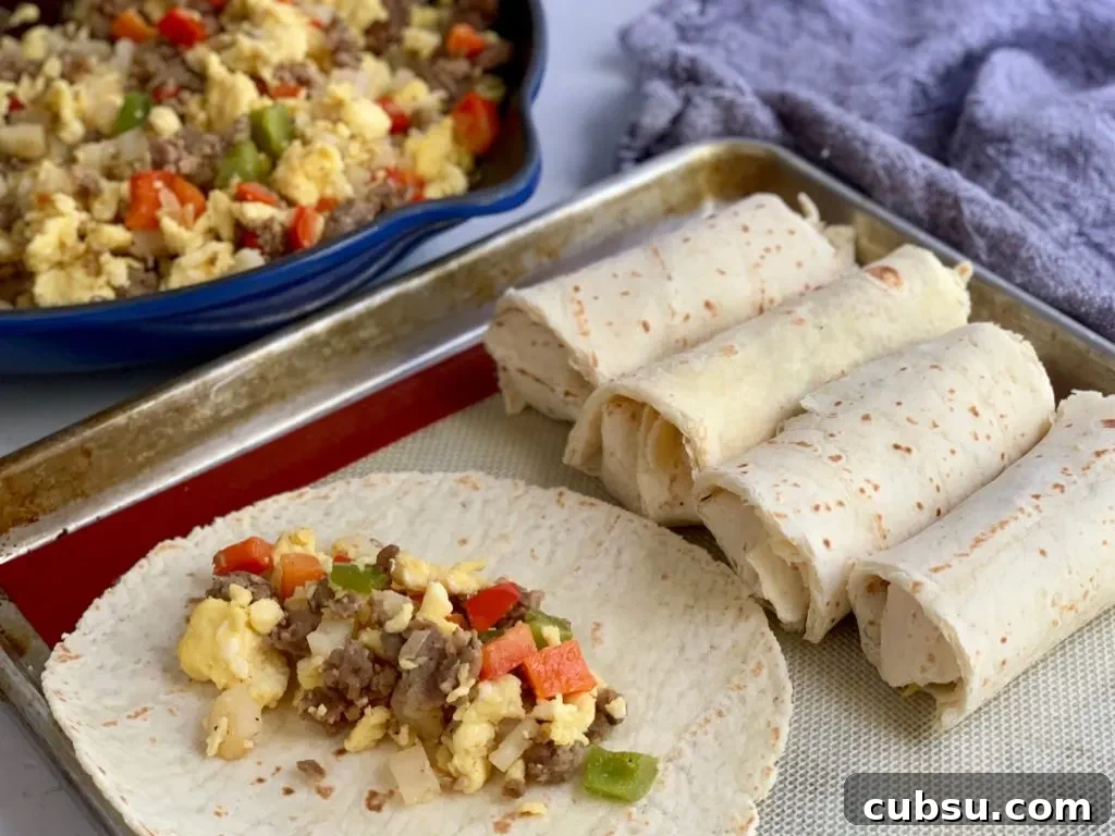 Make-Ahead Breakfast Burritos for Busy Mornings 6 sausage, eggs, onions, diced potatoes, and bell peppers on a gluten free tortilla