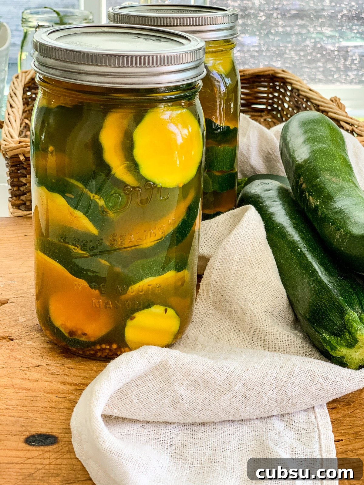 Quick Refrigerator Zucchini Pickles — No Canning Required 4 Two jars of pickles made from zucchini squash.