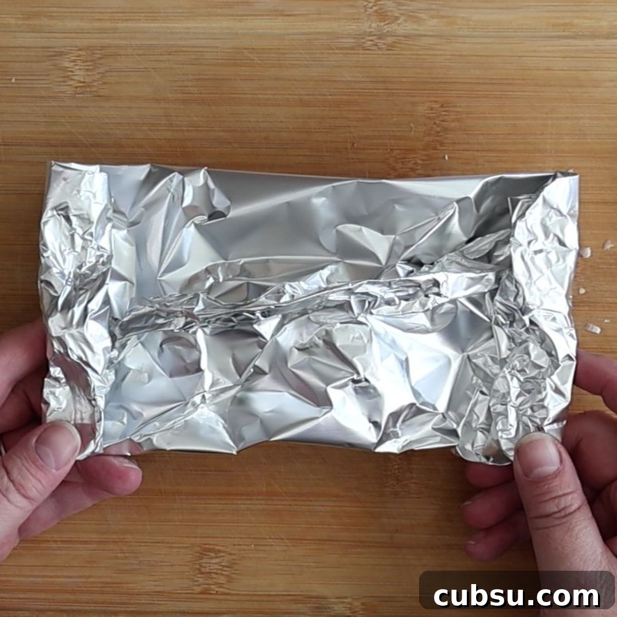 little foil package of garlic bulbs.