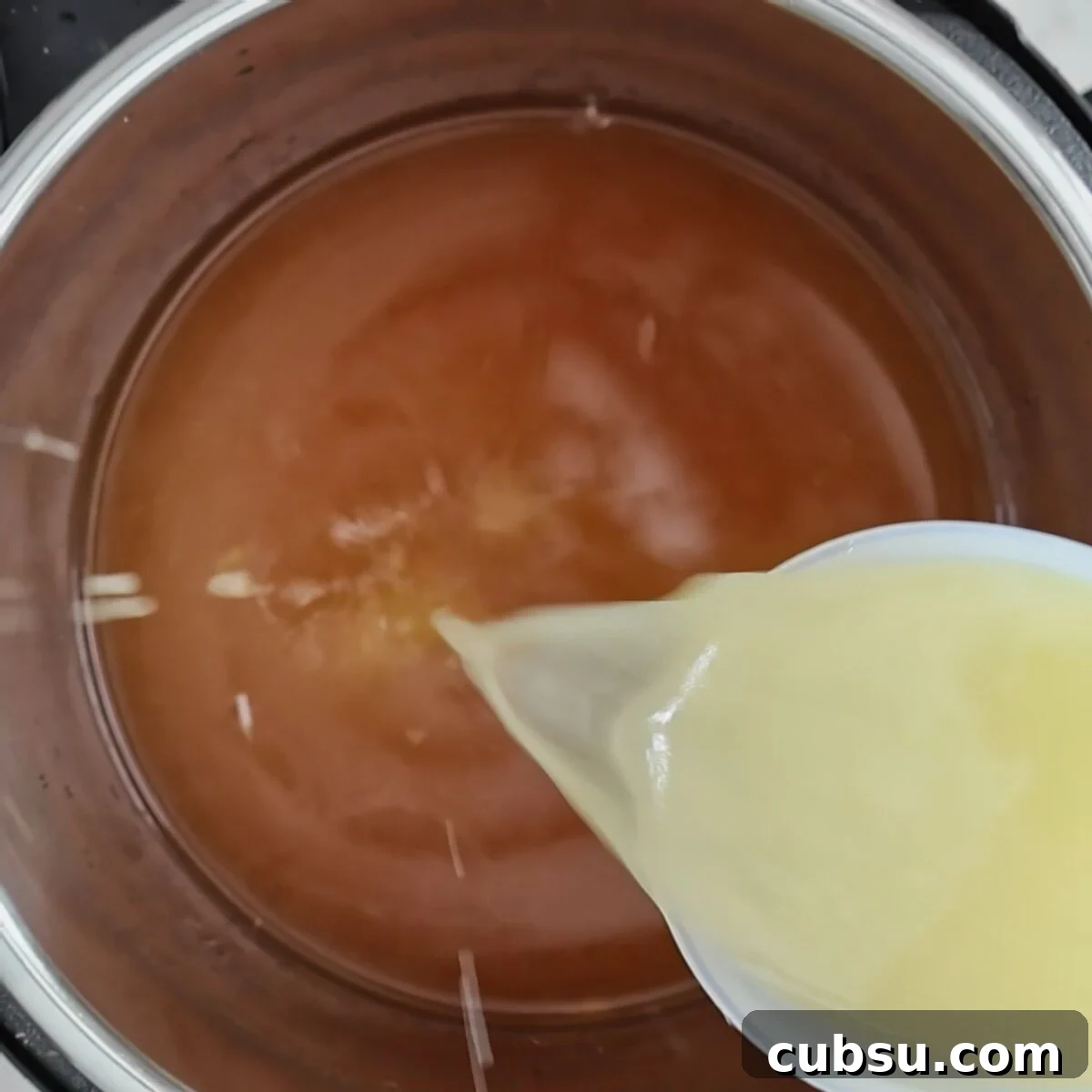 pouring lemon juice into instant pot.