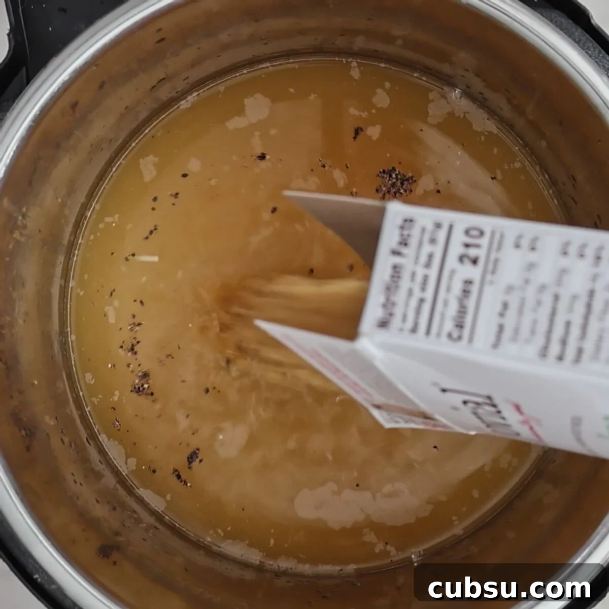 pouring box of pastina into instant pot.