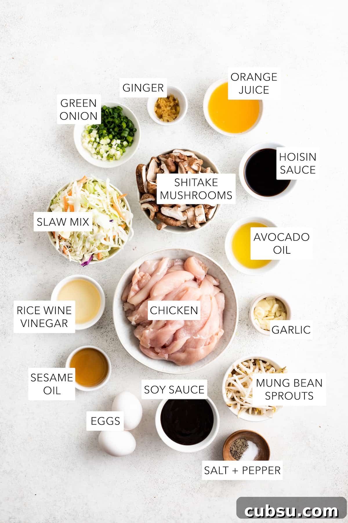 Ingredients for moo shu chicken separated into bowls and labeled.