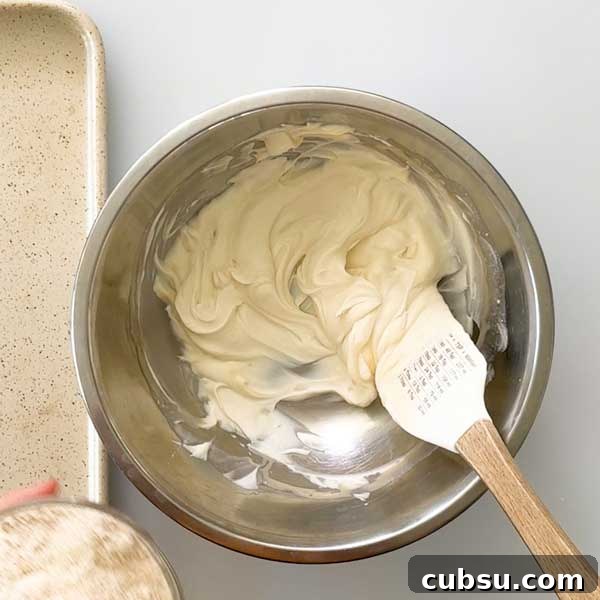 Stirring the wet ingredients for the muffin dough in a bowl.