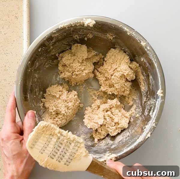 Dividing the dough into four muffins.