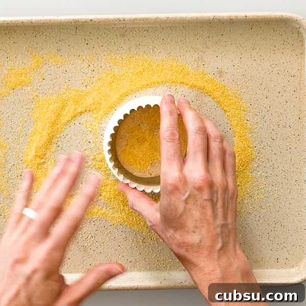 Shaping a circular muffin with a cookie cutter.
