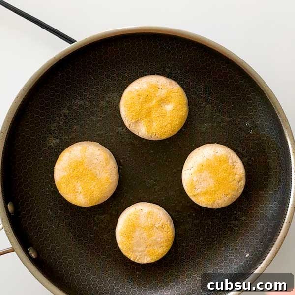 Cooking English muffins in a skillet.
