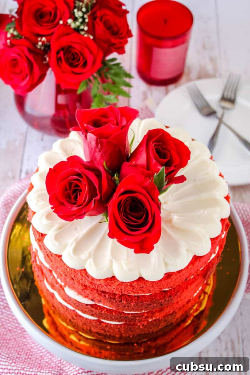 red velvet cake topped with fresh roses
