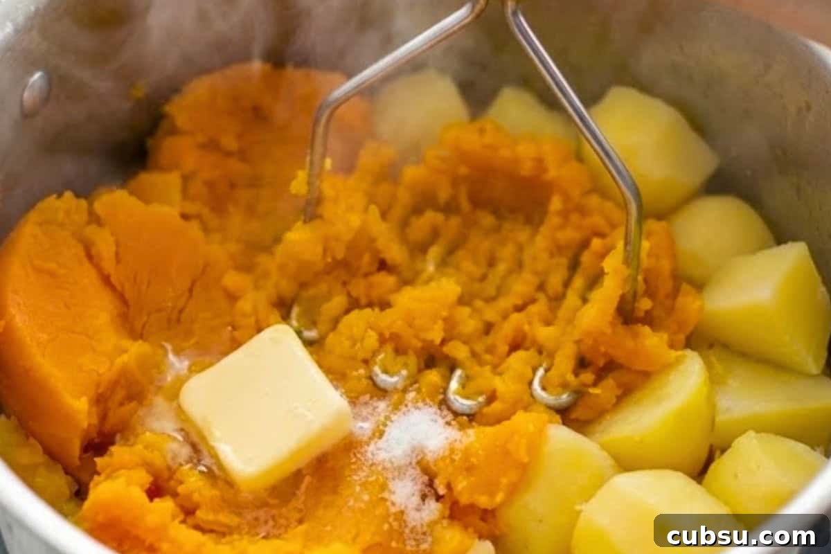 Preheat the oven to 200C | 400F and cook the pumpkin and potatoes in water until tender. Drain well, mash with butter until smooth