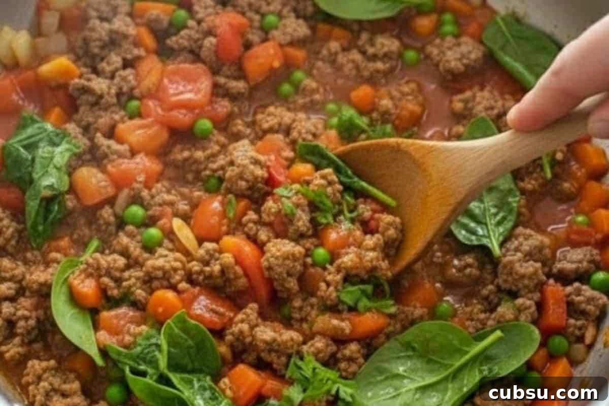 Pour in the gravy mixture or cornflour slurry and stir until the sauce thickens. Add the spinach and parsley