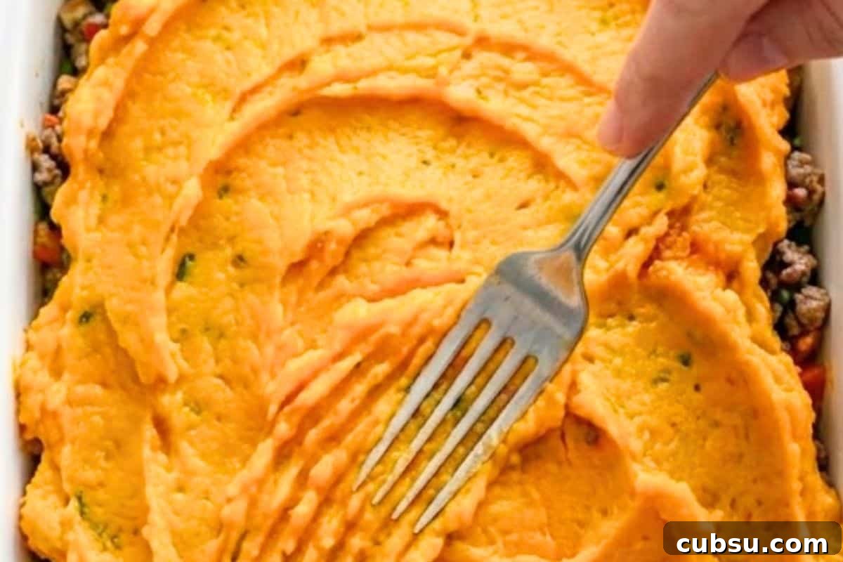 Spread half of the pumpkin mash into a baking dish in an even layer. Spoon the beef mixture over the top and cover with the remaining mash