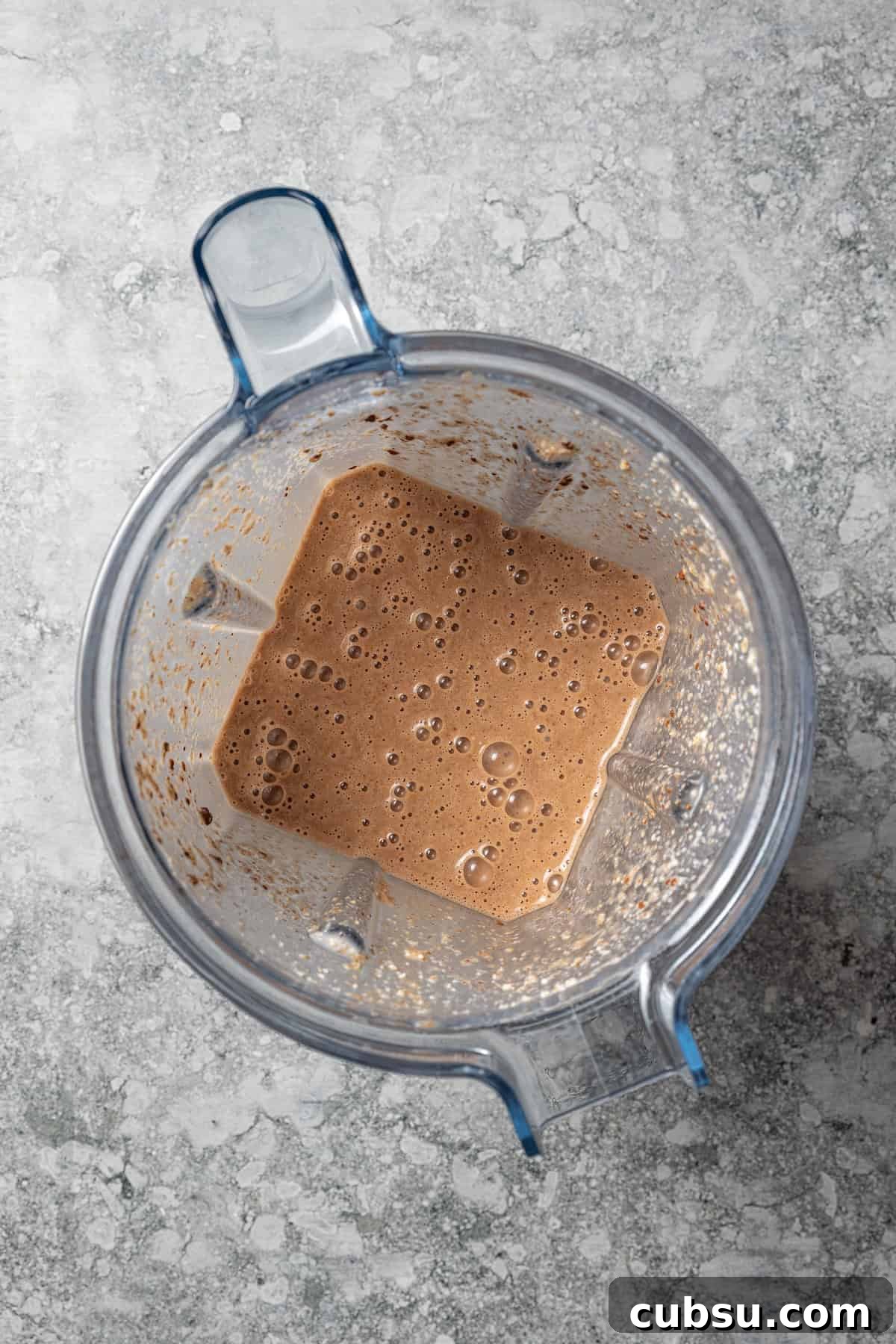 Blend, and enjoy! Coffee smoothie inside a blender.
