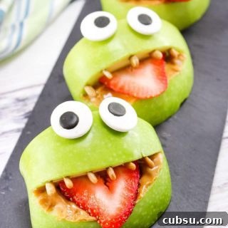 Made with apples, peanut butter, strawberries, sunflower seeds, and edible eyes, these Monster Apple Bites are a fun snack packed with nutrition! Perfect for Halloween or whenever you are looking for a fun snack idea for the kids.