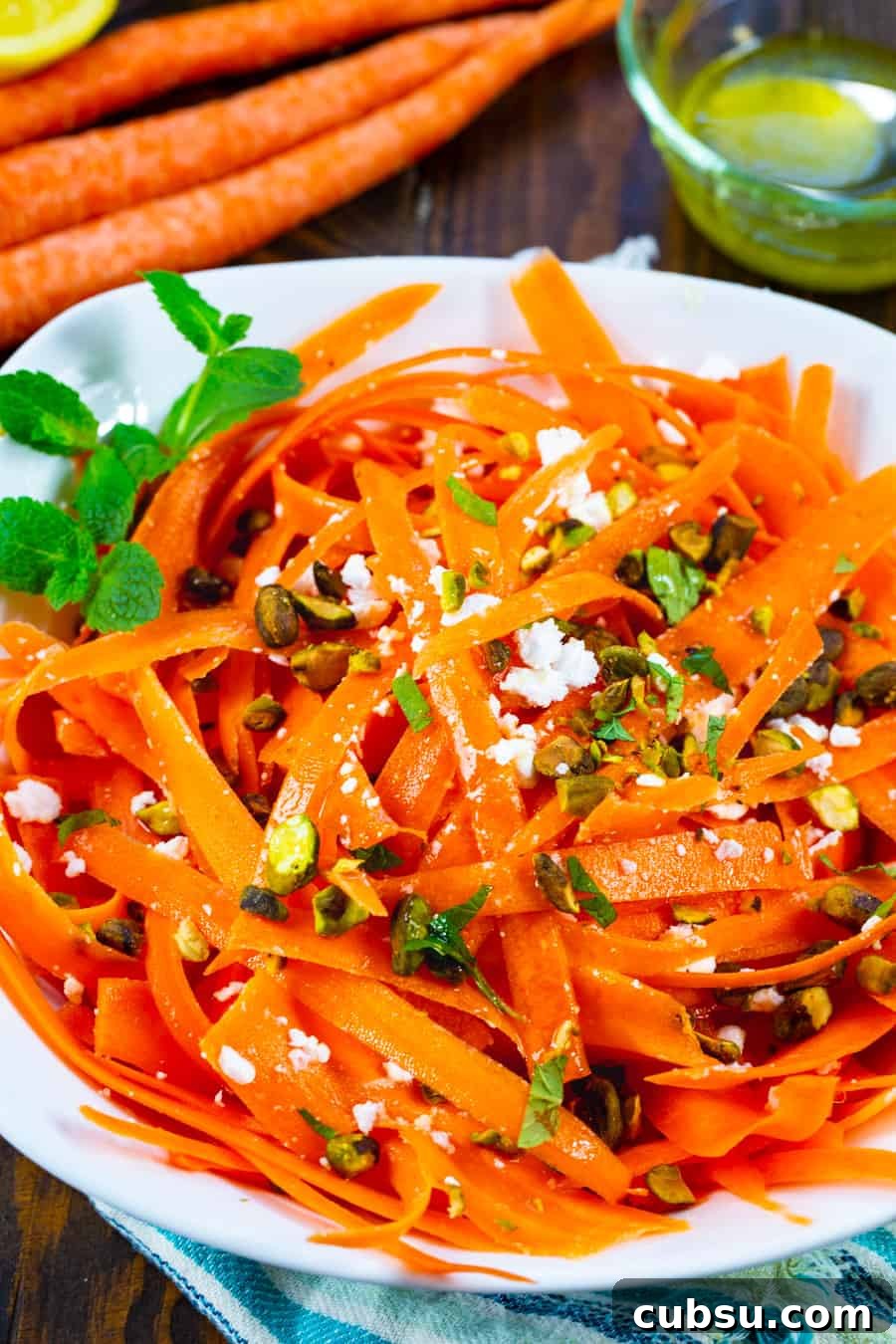 Refreshing Carrot and Feta Salad with Lemon-Dill Dressing 4 Carrot Feta Salad in a bowl with fresh mint.