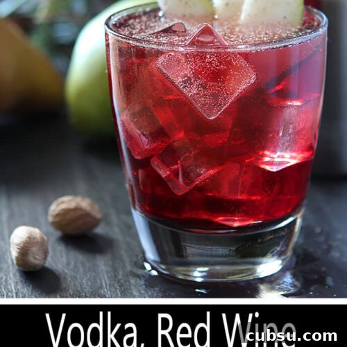 Spiced Pear, Vodka & Red Wine Cocktail Recipe 2 Vodka, Pear, and Red Wine Cocktail in a Lowball Glass with Pear and Nutmeg Garnish