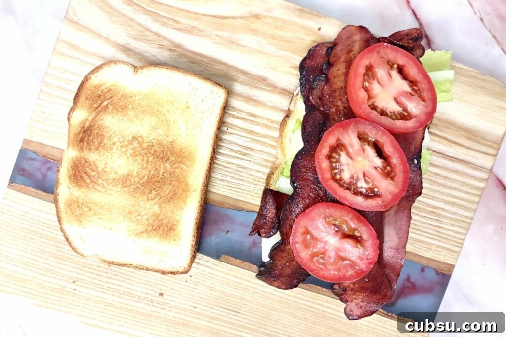 Crispy Air Fryer Turkey Bacon with Quick Sandwich Recipe 6 cooked turkey bacon in the air fryer on a blt sandwich