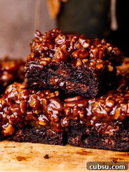 Stack of three pecan pie brownies.