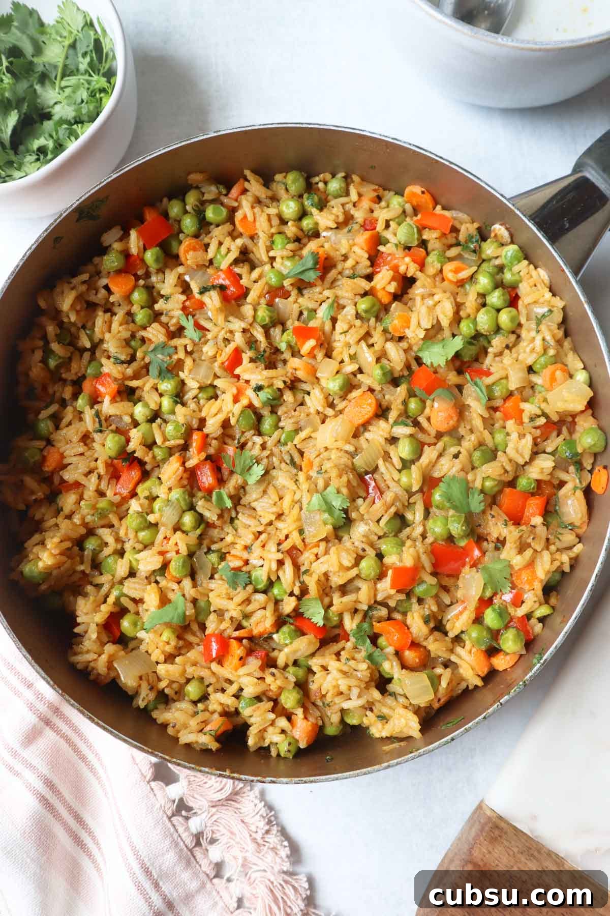 Green Curry Fried Rice Recipe: Authentic Thai Flavor in 30 Minutes 3 green curry fried rice in a large skillet with carrots, peas, and pepper