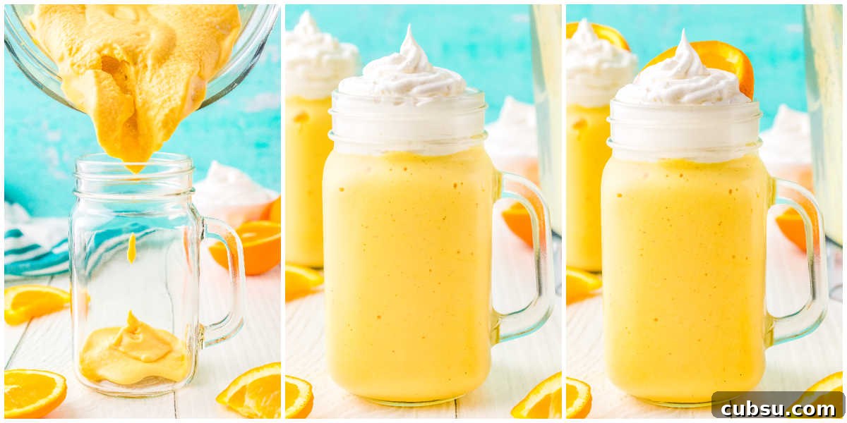 The orange milkshake poured into a glass and topped with whipped cream and an orange slice.