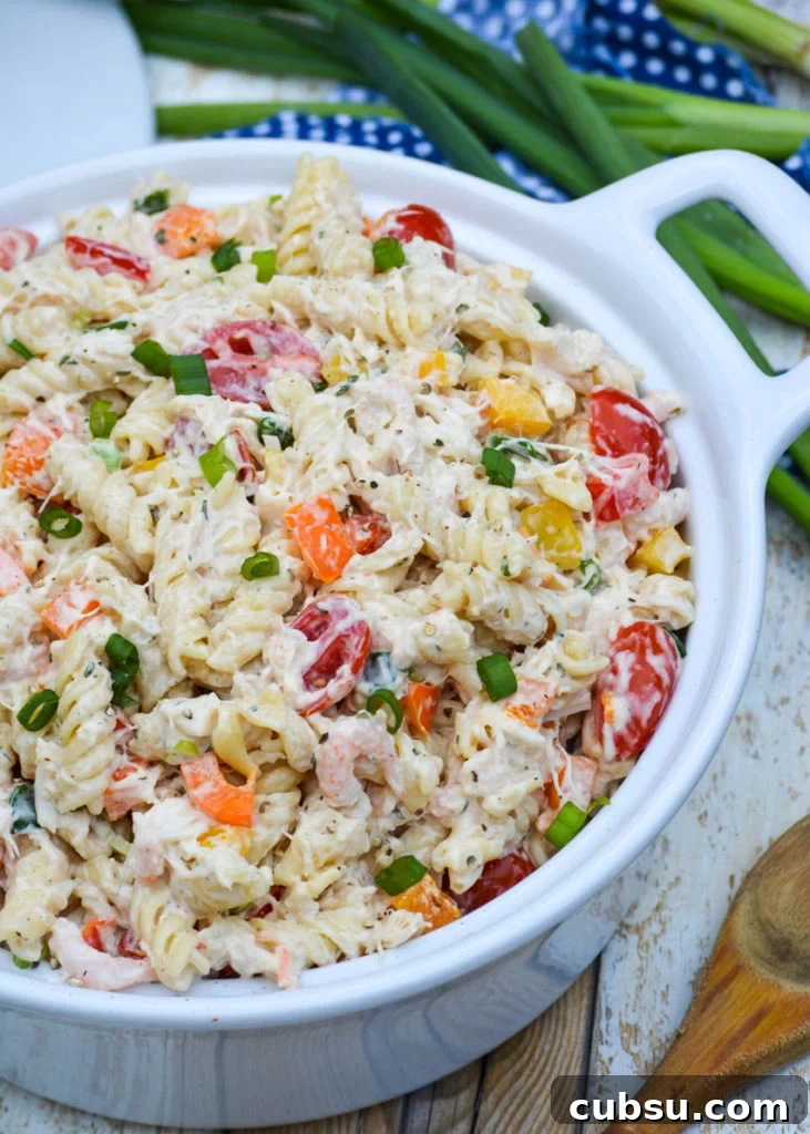 Mediterranean Seafood Pasta Salad with Lemon-Herb Dressing 2 creamy seafood pasta salad in a white ceramic bowl