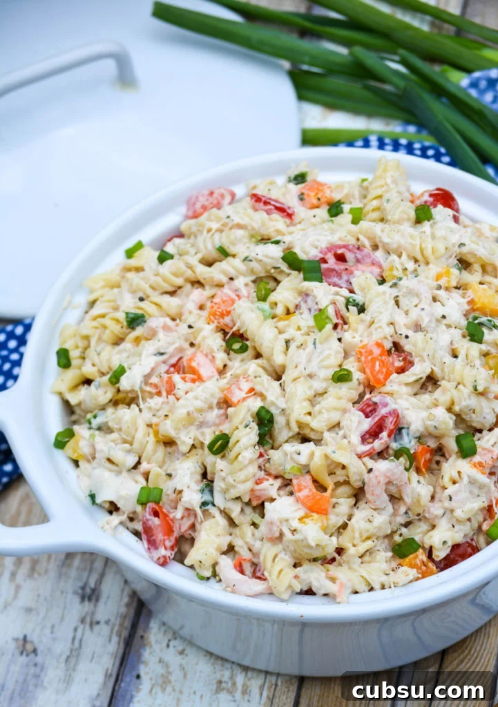 Mediterranean Seafood Pasta Salad with Lemon-Herb Dressing 3 creamy seafood pasta salad in a white ceramic bowl