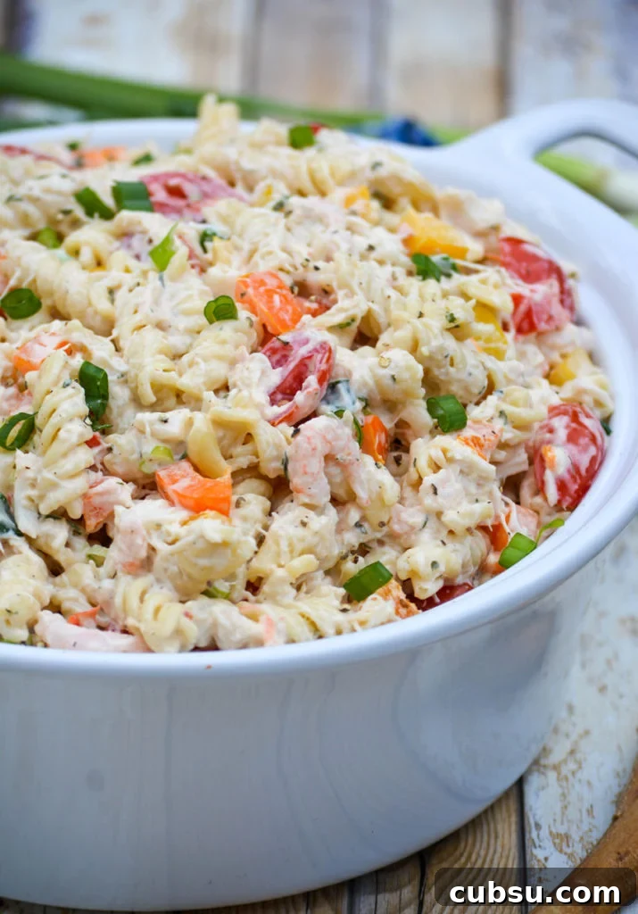 Mediterranean Seafood Pasta Salad with Lemon-Herb Dressing 5 creamy seafood pasta salad in a white ceramic bowl