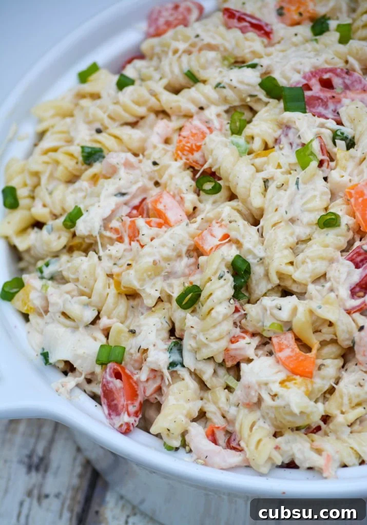 Mediterranean Seafood Pasta Salad with Lemon-Herb Dressing 6 creamy seafood pasta salad in a white ceramic bowl