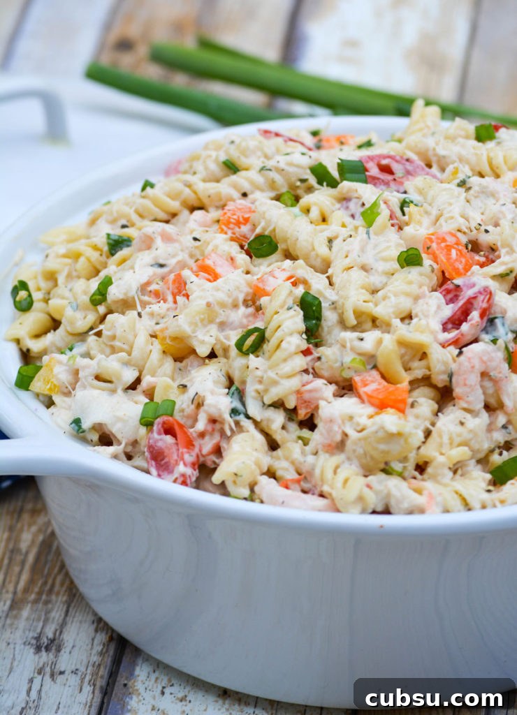 Mediterranean Seafood Pasta Salad with Lemon-Herb Dressing 7 creamy seafood pasta salad in a white ceramic bowl