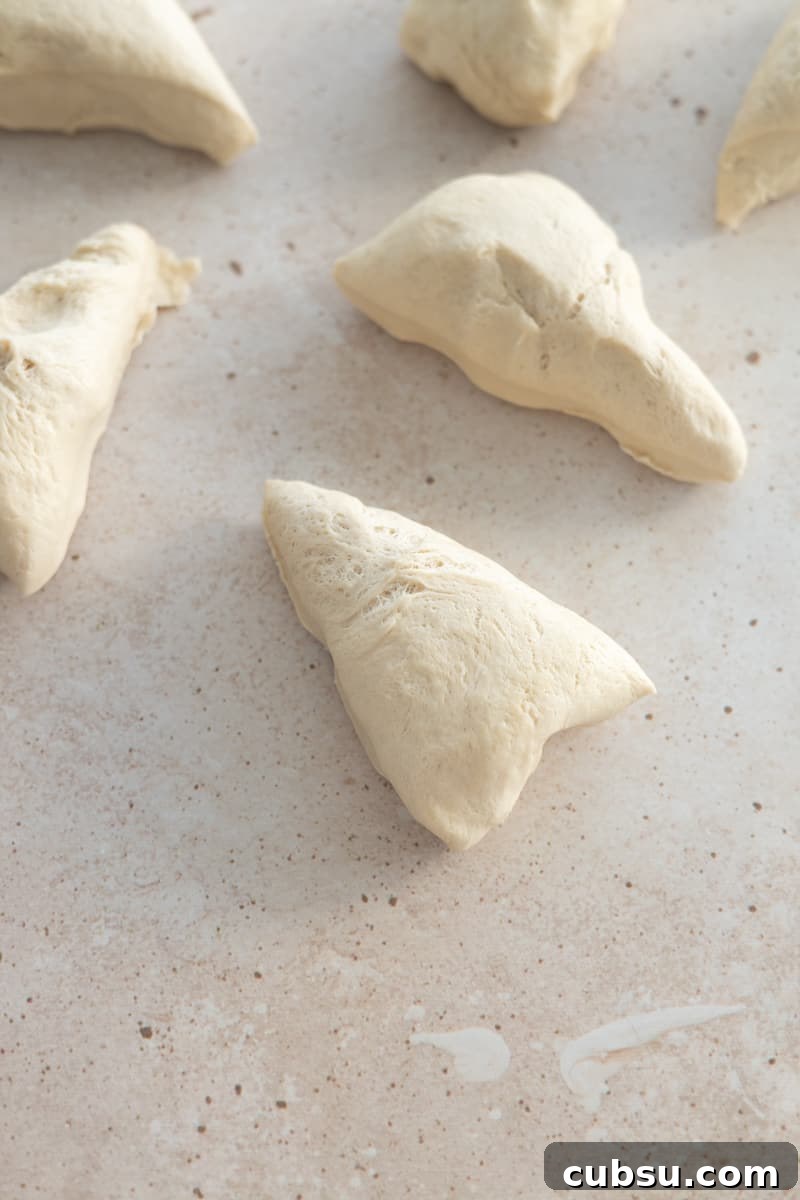 Crispy Sourdough Discard Pretzels: Tangy Soft-Baked Recipe 7 Dough divided into 8 triangles.
