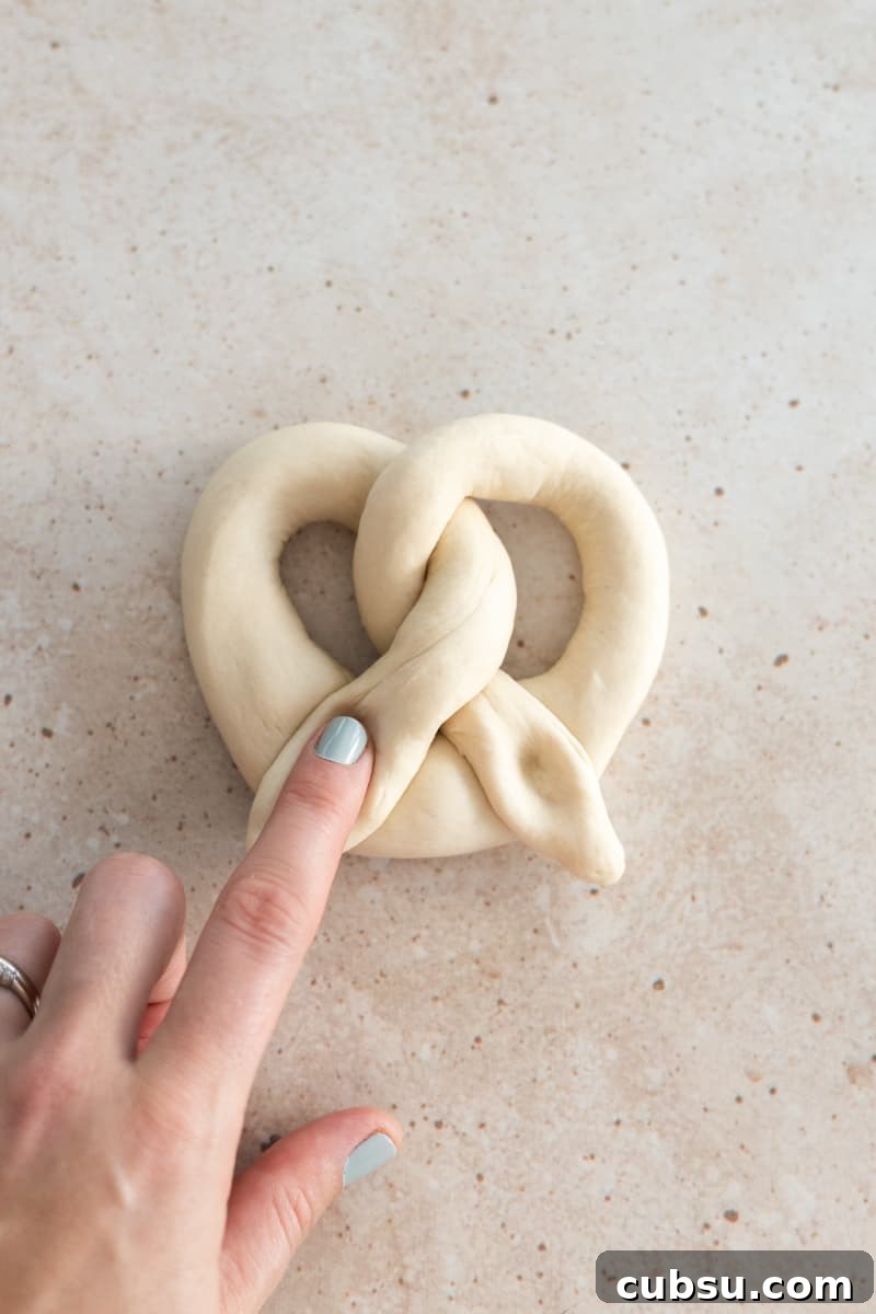Crispy Sourdough Discard Pretzels: Tangy Soft-Baked Recipe 10 Dough folded into a pretzel shape.