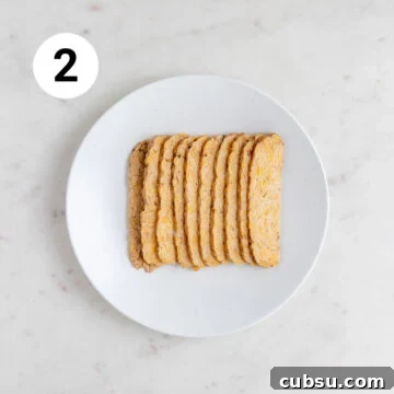 Crispy Tempeh Bacon Recipe: Smoky Vegan Bacon Alternative 11 Shallow dish with tempeh strips.