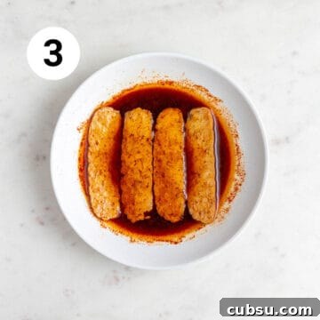 Crispy Tempeh Bacon Recipe: Smoky Vegan Bacon Alternative 12 Tempeh strips soaking in the marinade.