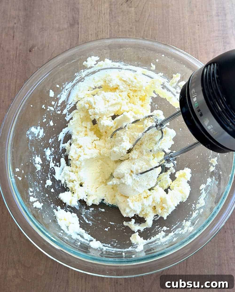 Creamy Tiramisu Dip Recipe for Coffee Lovers 5 creaming mascarpone and cream cheese in mixing bowl.