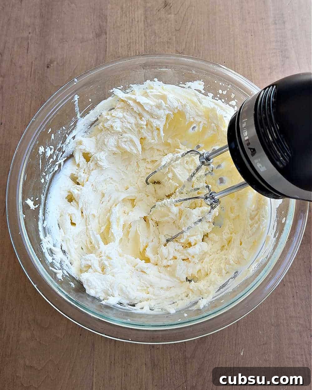 Creamy Tiramisu Dip Recipe for Coffee Lovers 6 mixing in heavy cream with electric mixer.