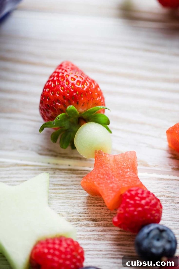 fruit kabob with a strawberry on top