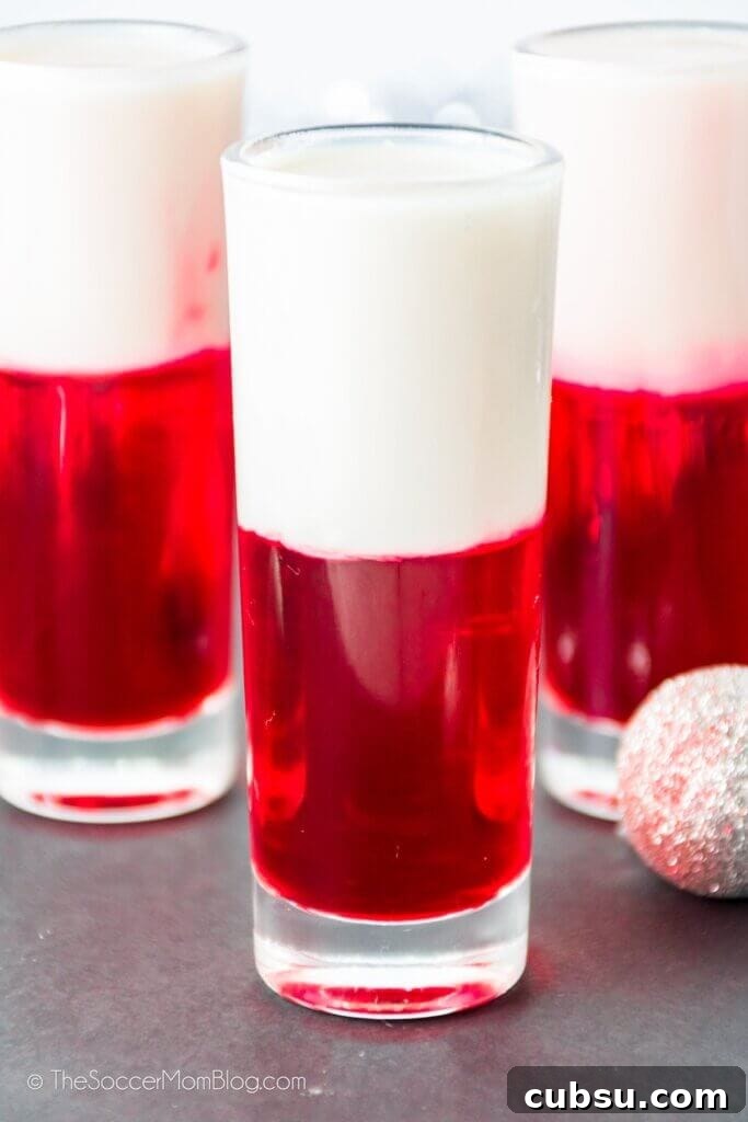 Festive Tipsy Santa Shooters Recipe for Holiday Parties 4 3 red and white layered Santa Shooters Christmas themed shots