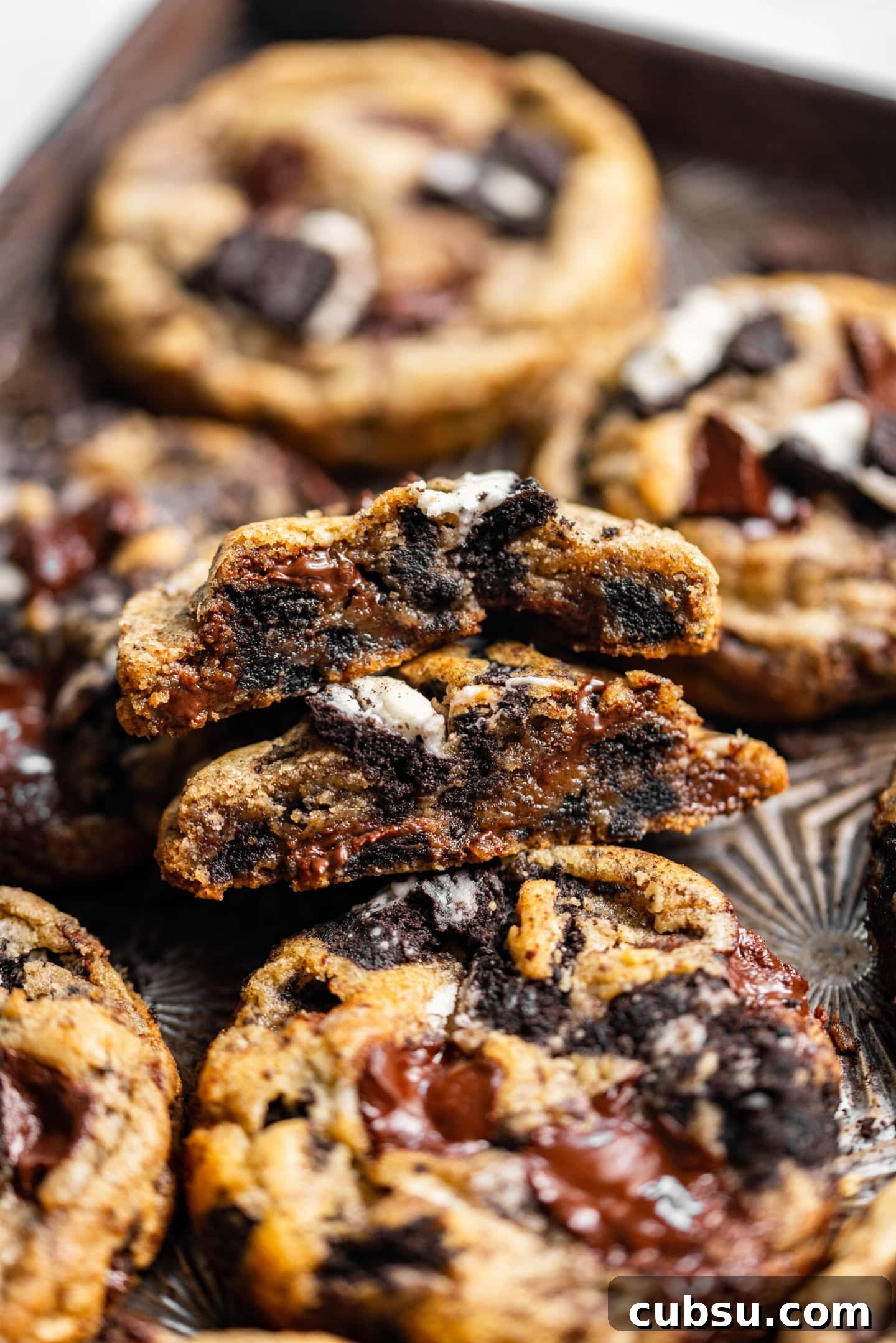 Chewy Oreo Chocolate Chip Cookies Recipe for Ultimate Indulgence 3 Close up of Oreo chocolate chip cookie broken in half showing off gooey inside texture.