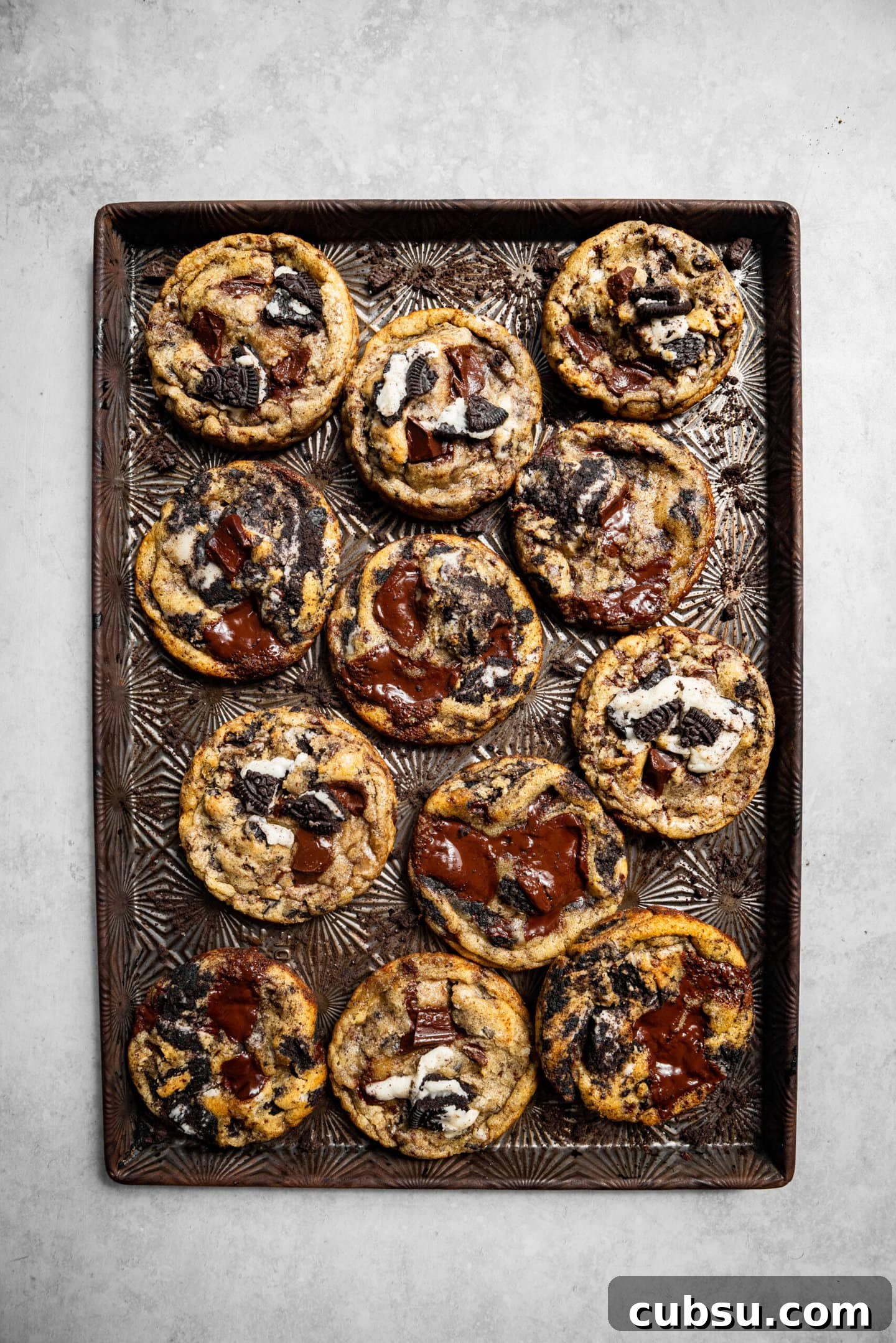 Chewy Oreo Chocolate Chip Cookies Recipe for Ultimate Indulgence 10 Freshly baked Oreo chocolate chip cookies on a cookie sheet.